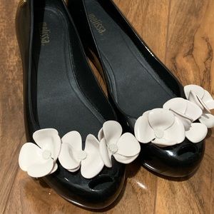 Black and white Melissa flats